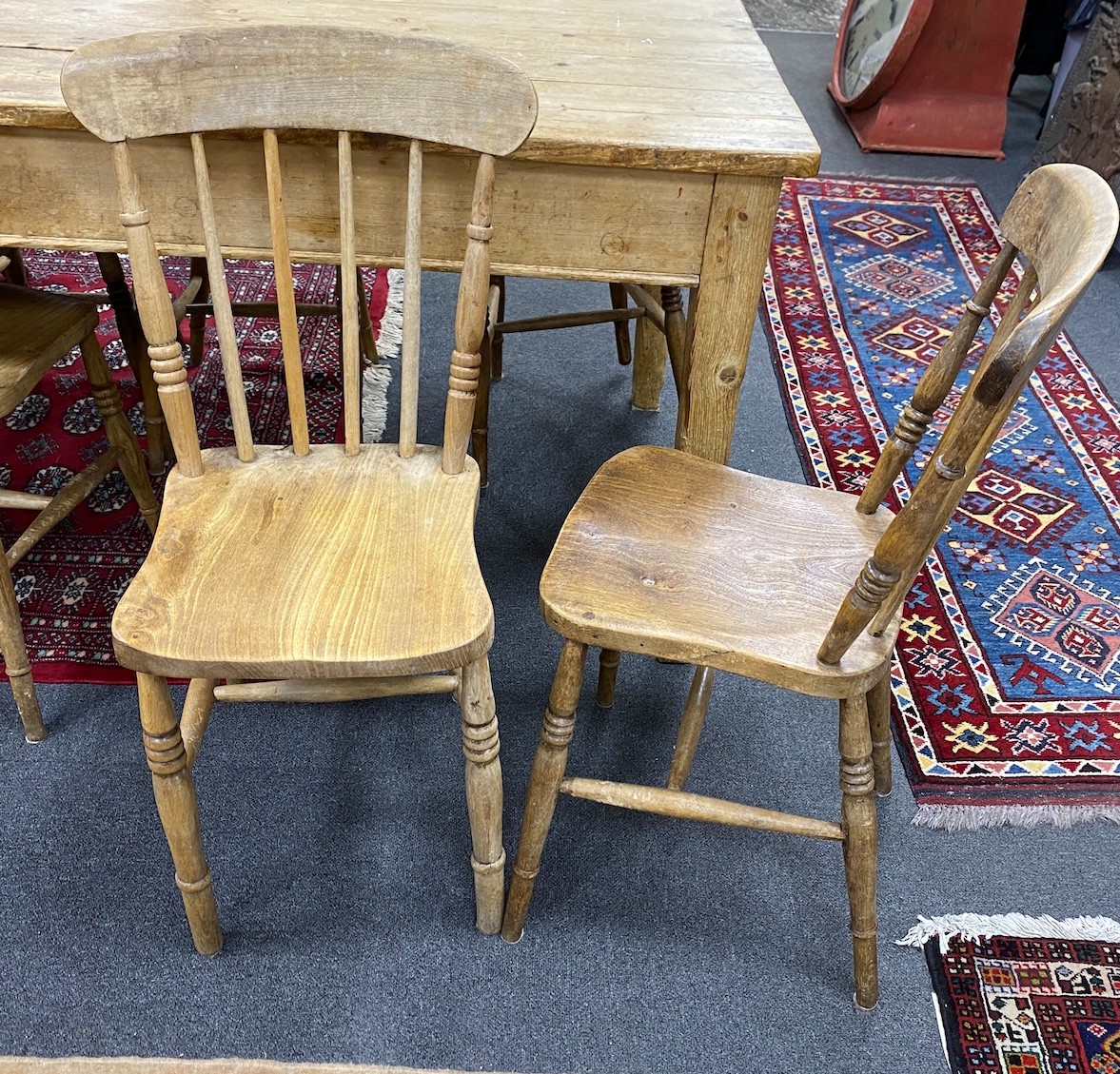 A Victorian rectangular pine kitchen table, length 136cm, depth 81cm, height 77cm together with six Victorian elm and beech Windsor comb back kitchen chairs